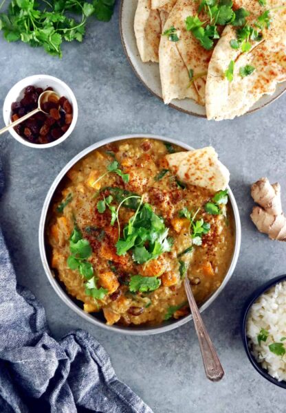 This Vegan Indian Mango Butternut Squash Curry features a creamy mango curry sauce, diced butternut squash, all wrapped in some delicious warm spices.