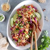 This crunchy Thai quinoa salad served with a ginger peanut butter dressing is a lovely twist to the classic Pad Thai.