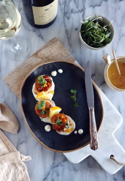 Pan-seared scallops with an orange ginger sauce is a light, elegant dish, enhanced with citrus flavors. Ready under 20 minutes, it's a lovely starter to a 3-course dinner.