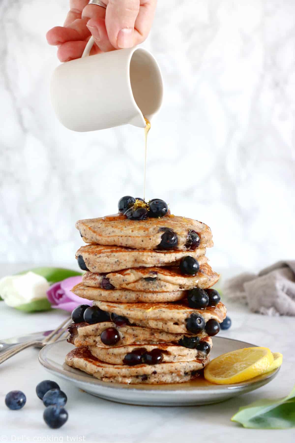 These lemon poppy seed blueberry pancakes are sugar-free, packed with fruits and prepared with whole-wheat flour.
