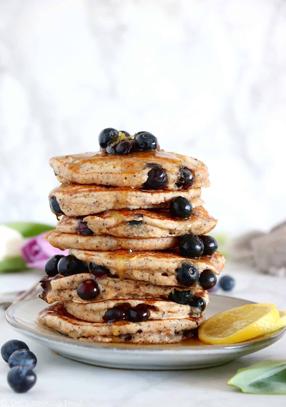 These lemon poppy seed blueberry pancakes are sugar-free, packed with fruits and prepared with whole-wheat flour.