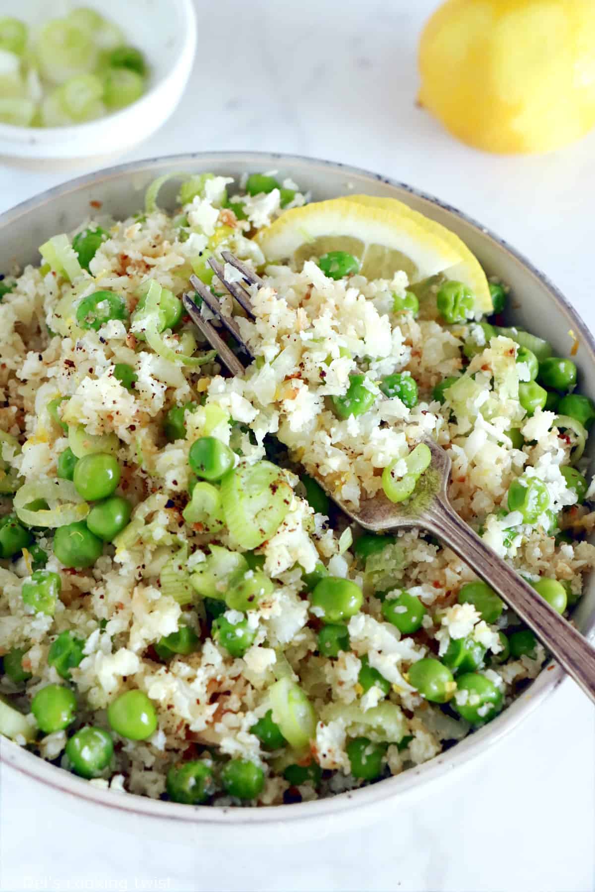 Learn how to make healthy cauliflower rice with peas in no time. This super easy side recipe is a great substitute for rice and the perfect way to sneak in more veggies into your diet.