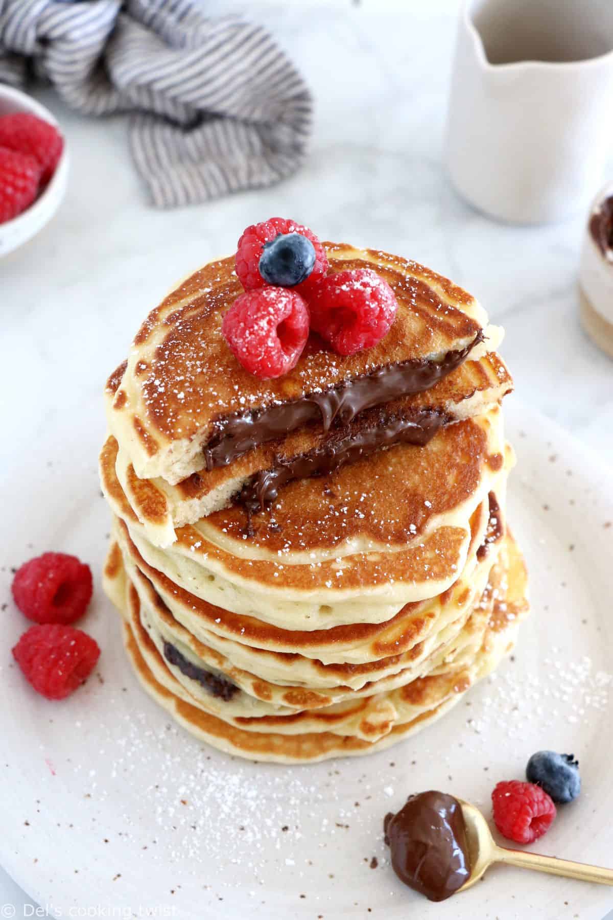 Nutella-stuffed pancakes are a dream come true! Imagine a stack of pillowy soft, fluffy pancakes, oozing with a warm chocolate center.