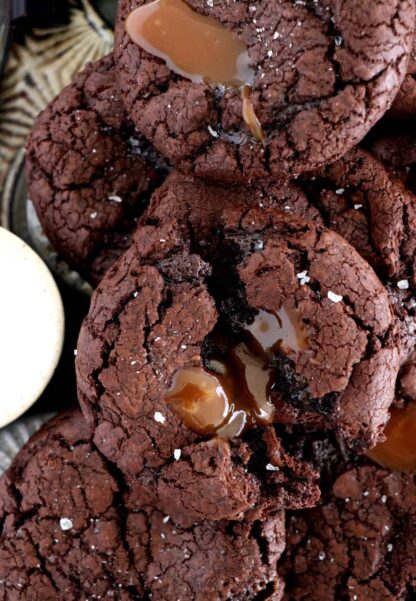 Salted caramel stuffed brownie cookies are slightly crinkly on top, fudgy, loaded with chocolate, with a gooey salted caramel center.