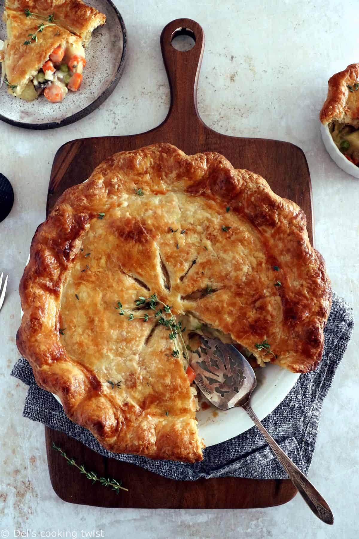 A rustic vegetarian pot pie loaded with hearty veggies coated in a creamy gravy, and tucked in between two crunchy flaky pie crusts.