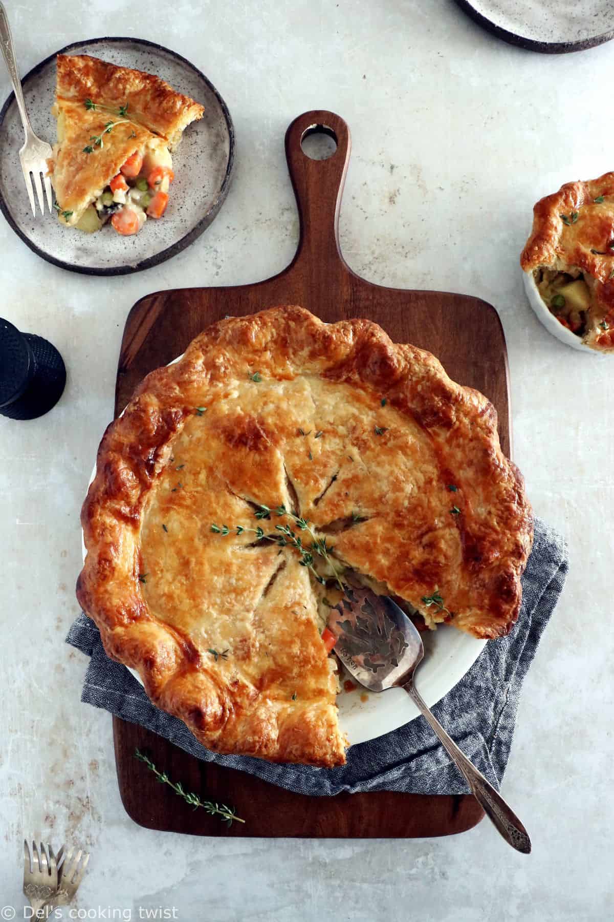 A rustic vegetarian pot pie loaded with hearty veggies coated in a creamy gravy, and tucked in between two crunchy flaky pie crusts.