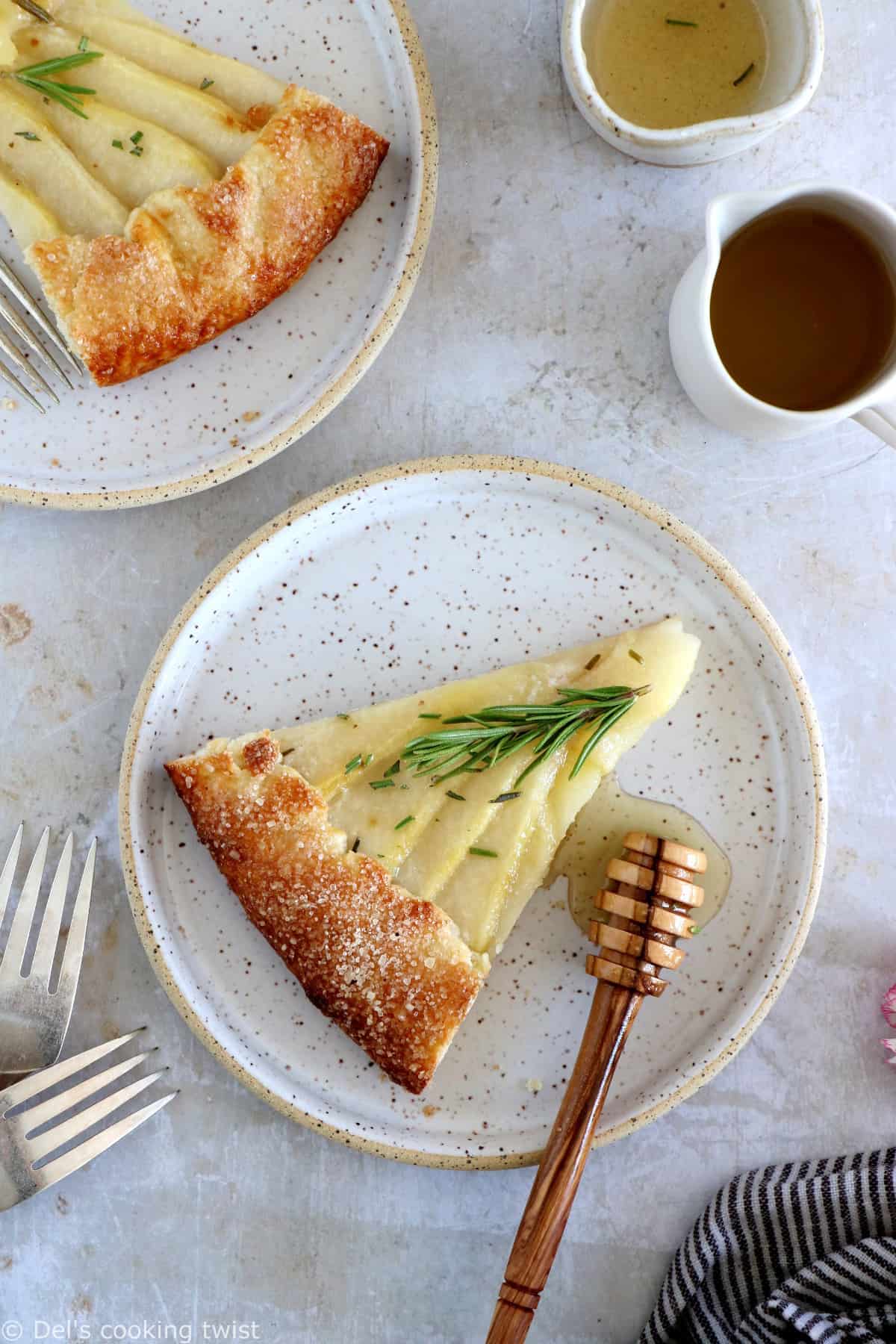 This rosemary honey pear galette is an easy pear tart recipe, featuring an irresistible flaky crust and some juicy pears infused in a rosemary honey syrup.