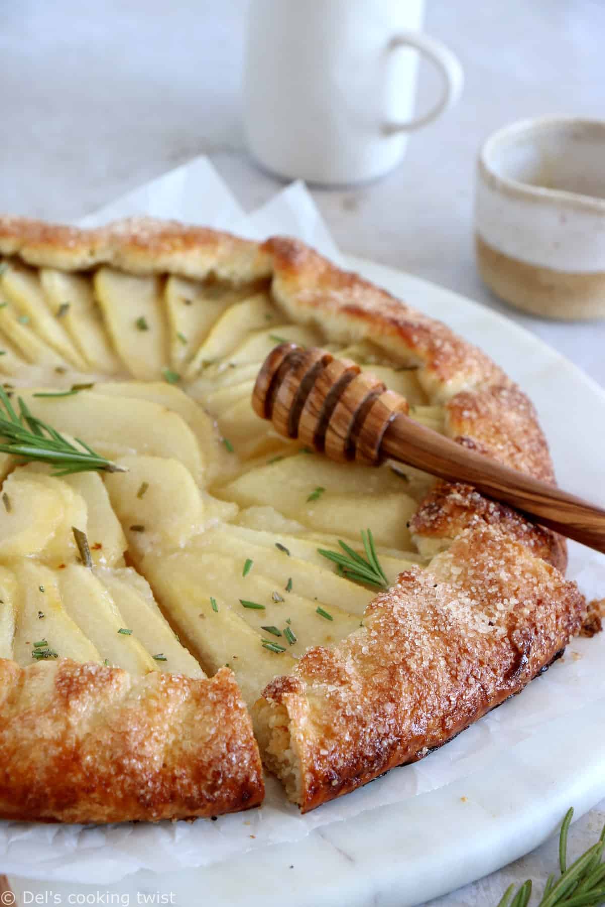 This rosemary honey pear galette is an easy pear tart recipe, featuring an irresistible flaky crust and some juicy pears infused in a rosemary honey syrup.