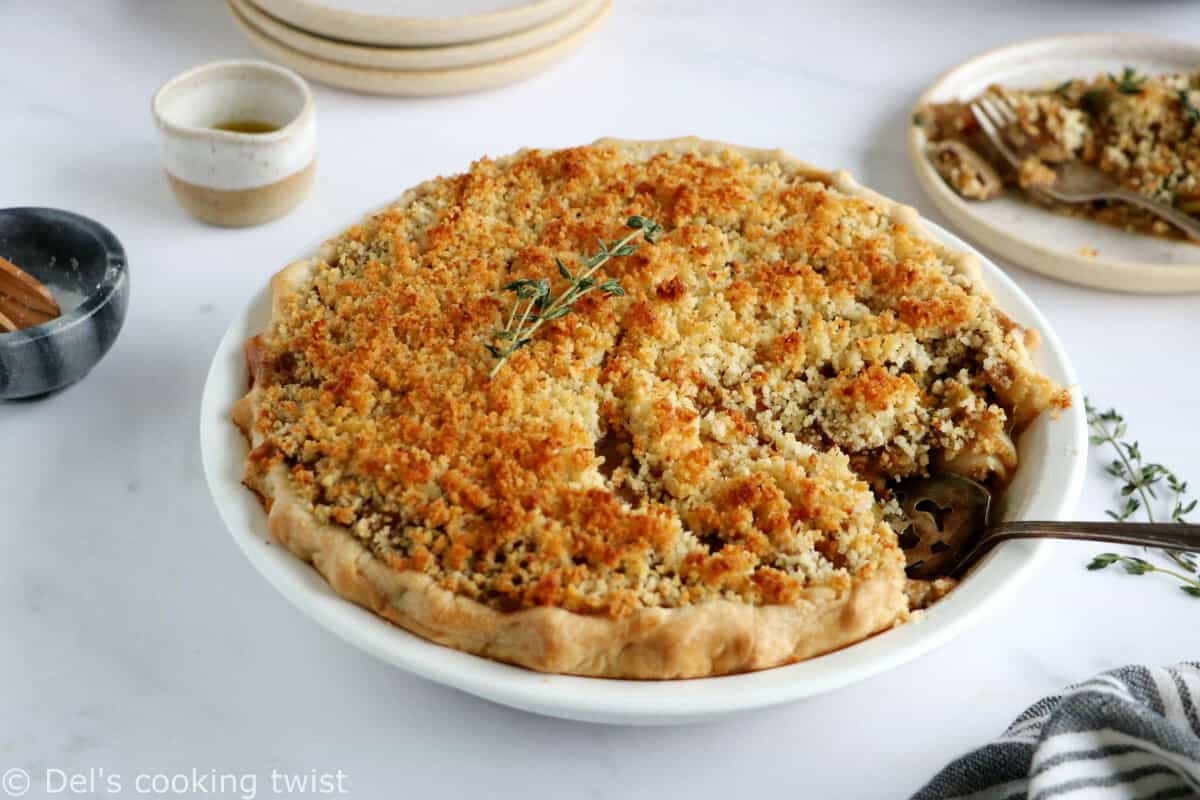 This vegetarian pot pie with crumble topping features some leek, shallots and mushrooms deglazed with white wine, and then coated in a creamy bechamel sauce.