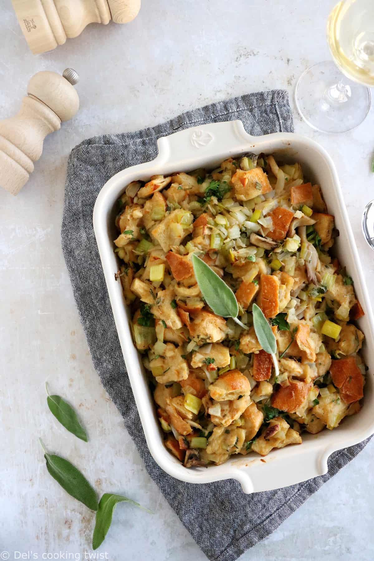 This vegetarian stuffing with leeks and wild mushrooms features a loaf of bread teared apart, veggies for a wonderful texture and depth of flavor, and a perfect seasoning with herbs.