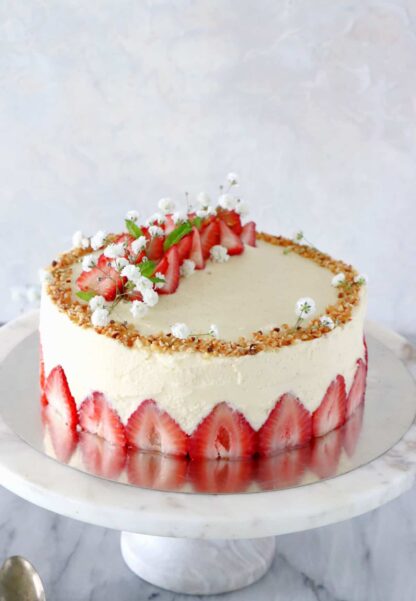 Fraisier cake is a traditional French strawberry cake, consisting of two layers of genoise sponge, filled with a silky delicious vanilla mousseline cream and fresh strawberries.