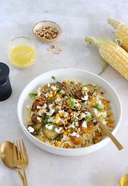 This corn and zucchini orzo salad with goat cheese is tossed together with a cumin vinaigrette and some mint for a very refreshing touch.