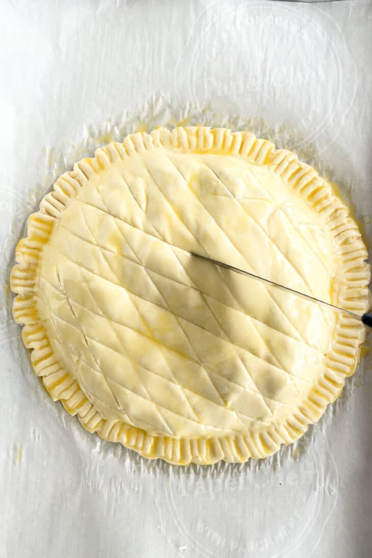 Leek and potato pithivier is comfort food at its finest. This potato pie combines layers of sliced potatoes, Comte cheese, and leeks, all tossed in a golden and flaky puff pastry.