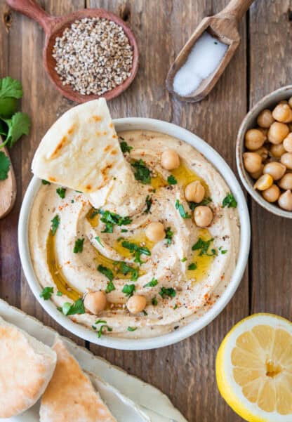 Roasted garlic hummus is the ultimate hummus recipe! Super creamy, sweet and slightly smoky, this dip makes a fantastic snack or appetizer.