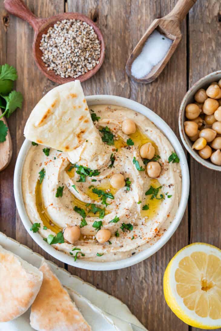 Roasted garlic hummus is the ultimate hummus recipe! Super creamy, sweet and slightly smoky, this dip makes a fantastic snack or appetizer.