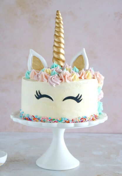 This unicorn cake is a 3-layer funfetti cake, covered with white and pastel buttercream. Perfect for a kid's birthday party or a baby shower.