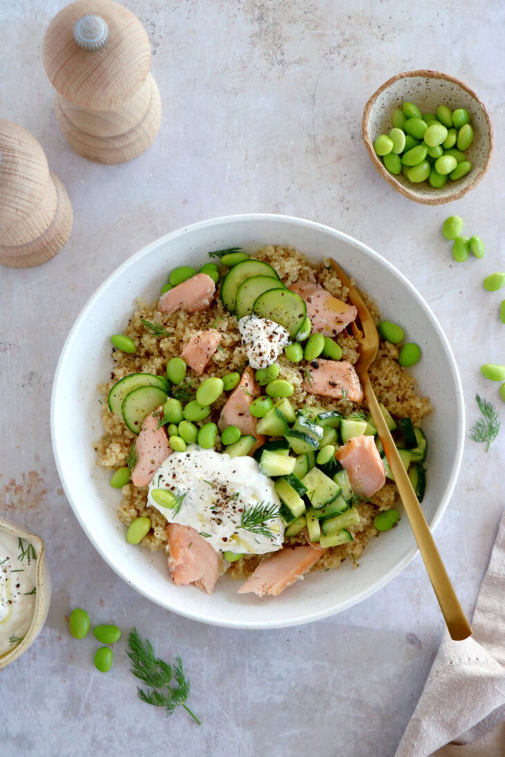 This delicious salmon quinoa bowl with edamame and a dill-feta dip makes a great lunch recipe. Healthy and nutritious!