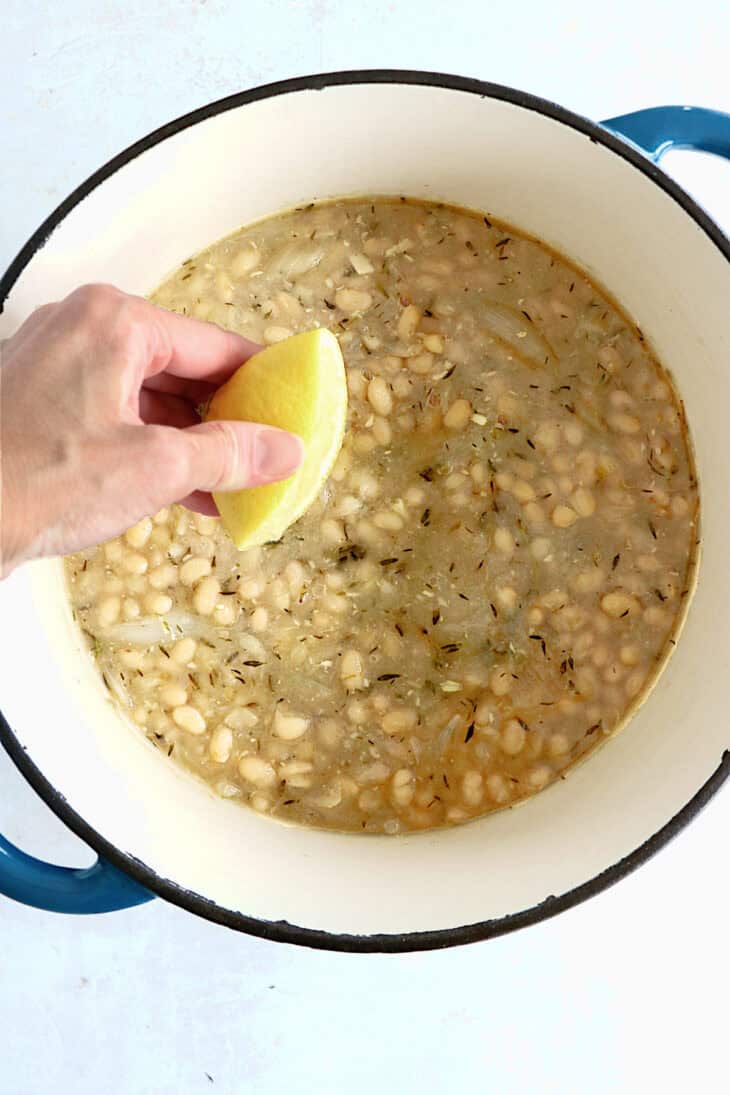 These brothy white beans infused with fresh herbs make a cozy meal packed with flavors. They're easy to make (no soaking time needed).