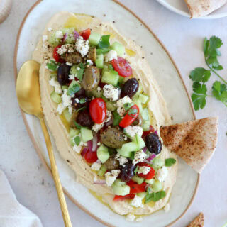 This loaded hummus dip is an easy crowd-pleasing appetizer, with lots of textures and refreshing flavors.