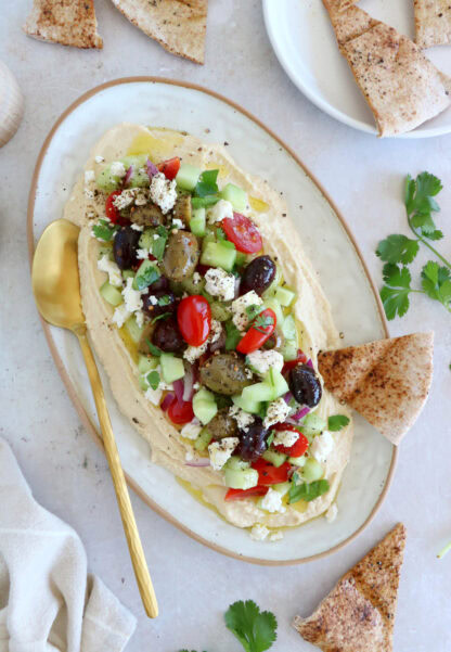 This loaded hummus dip is an easy crowd-pleasing appetizer, with lots of textures and refreshing flavors.