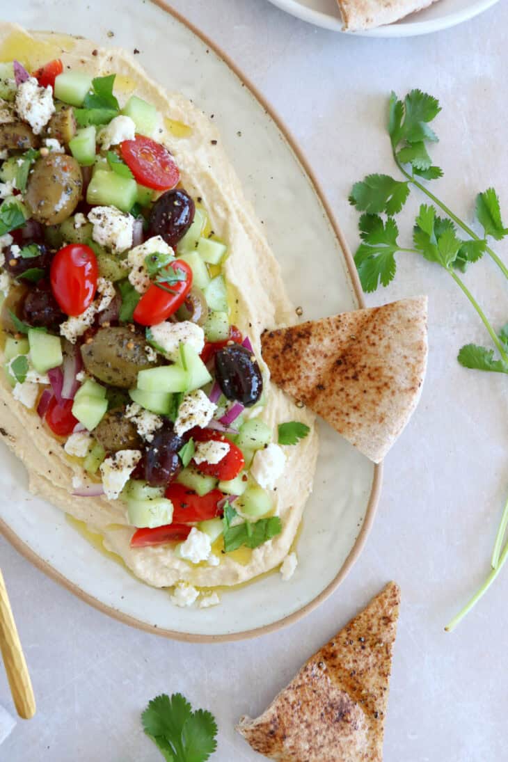 This loaded hummus dip is an easy crowd-pleasing appetizer, with lots of textures and refreshing flavors.