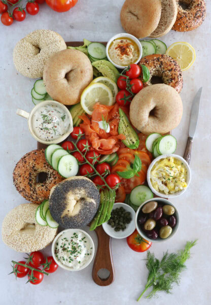 Take brunch to the next level with this smoked salmon bagel brunch board! Easy to assemble with lots of different toppings, it's the perfect grazing board to entertain with for a casual intimate brunch or a festive party brunch with friends.