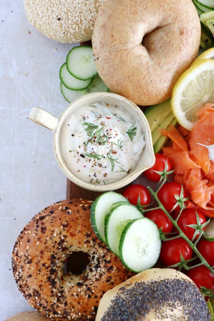 Take brunch to the next level with this smoked salmon bagel brunch board! Easy to assemble with lots of different toppings, it's the perfect grazing board to entertain with for a casual intimate brunch or a festive party brunch with friends.