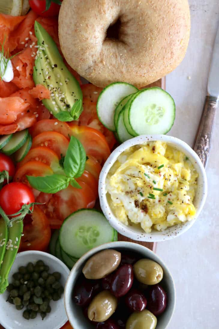 Take brunch to the next level with this smoked salmon bagel brunch board! Easy to assemble with lots of different toppings, it's the perfect grazing board to entertain with for a casual intimate brunch or a festive party brunch with friends.