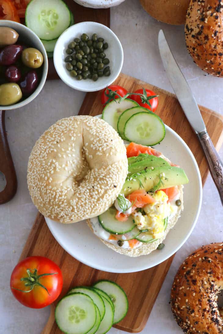 Take brunch to the next level with this smoked salmon bagel brunch board! Easy to assemble with lots of different toppings, it's the perfect grazing board to entertain with for a casual intimate brunch or a festive party brunch with friends.