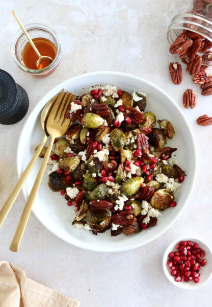 Maple balsamic Brussels sprouts with feta, pomegranate and pecans make a fantastic side dish for the holidays.