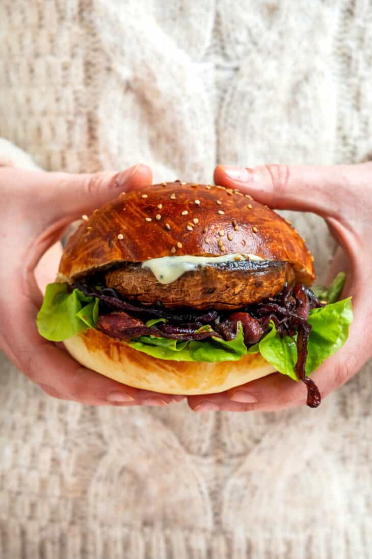 This Portobello mushroom burger with blue cheese and caramelized onions is loaded with incredible umami flavors.