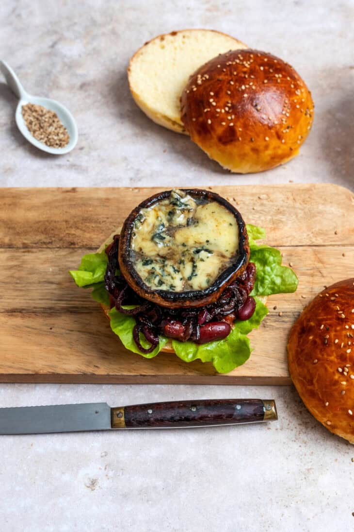 This Portobello mushroom burger with blue cheese and caramelized onions is loaded with incredible umami flavors.