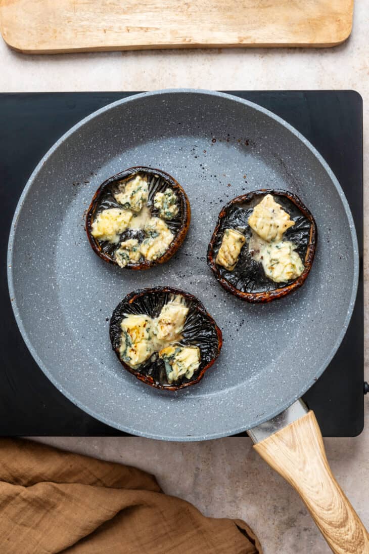 This Portobello mushroom burger with blue cheese and caramelized onions is loaded with incredible umami flavors.