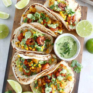 These sheet pan pineapple shrimp tacos with a spicy jalapeño sauce make an easy 20-minute dinner, that tastes better than takeout.