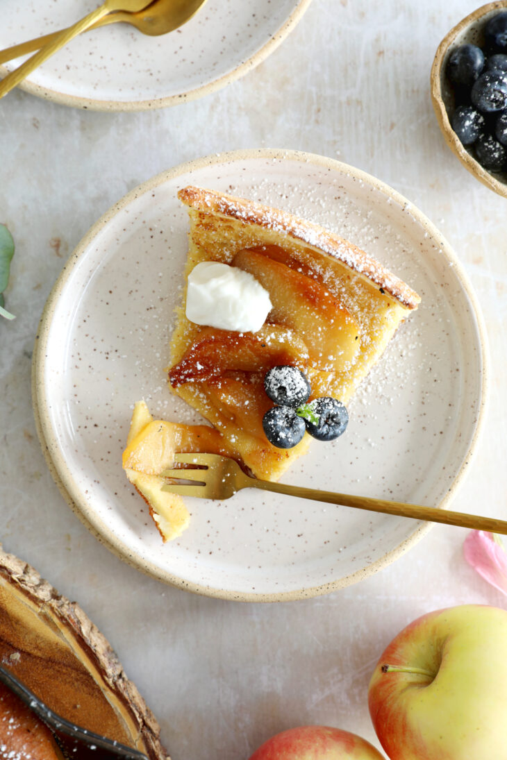 Apple Dutch Baby Pancake - Baked in a large, hot skillet, this giant pancake puffs up like a popover and is topped with caramelized apples.