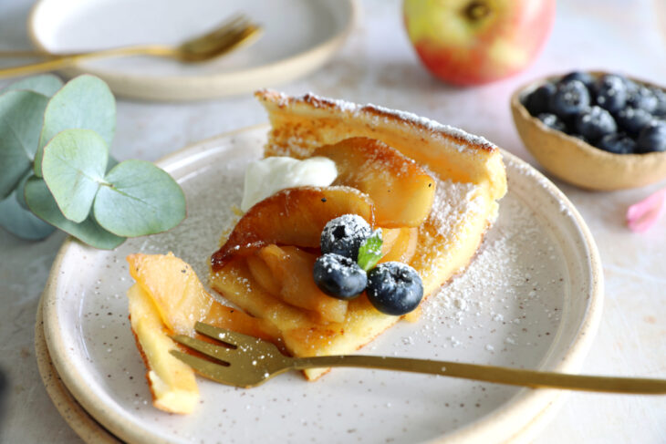 Apple Dutch Baby Pancake - Baked in a large, hot skillet, this giant pancake puffs up like a popover and is topped with caramelized apples.